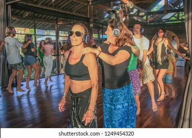 Bali, Indonesia - December 1, 2018: Conga Line Of Women Dancing During Silent Disco Event