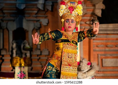 Bali, Indonesia - May 21, 2019: Female Balinese dancer performing Legong dance wearing traditional ceremonial costumes in Ubud, Bali, Indonesia.