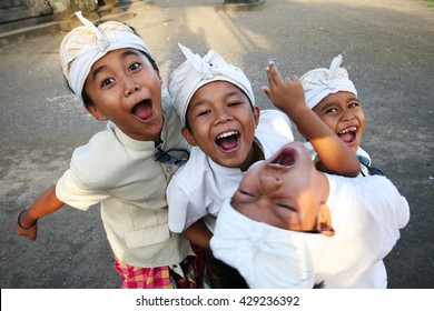 Bali, Indonesia. May 4, 2007. The Group Of Unidentified Balinese Kids Is Fooling For The Camera. 