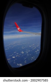 Bali, Indonesia - September 27, 2013: Lion Air Plane Wings Flying Above The Clouds