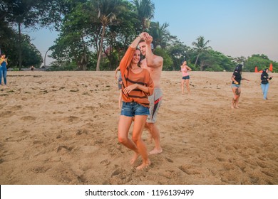 Bali, Indonesia - September 30, 2018: Caucasian Couple Salsa Dancing On The Beach During Silent Disco