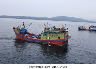 Bali Strait, May 2022. Fishermen In A Big Fishing Boat Sailing In The Blue Sea To Catch Fish And Will Take It To The Fish Auction Place After Catching A Lot Of Fish With Nets And Trawler. Taxi Water