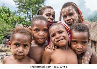 BALIEM VALLEY, WEST PAPUA, INDONESIA, MAY 16th, 2016: Dugum Dani tribe people. Unidentified children of Dugum Dani tribe in a small  village on 16, May 2016 in West Papua, Indonesia.