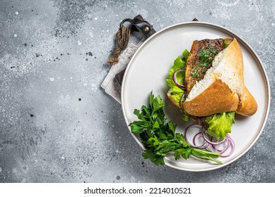 Balik Ekmek Turkish Fish Sandwich With Grilled Mackerel Fillet In A Bun. Gray Background. Top View. Copy Space.