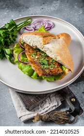 Balik Ekmek Turkish Fish Sandwich With Grilled Mackerel Fillet In A Bun. Gray Background. Top View.