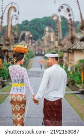 Balinese Couple Portrait From Behind While Walking In Penglipuran Heritage Village