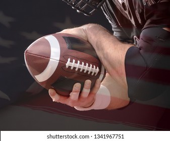 Ball Of American Football In Footballer Hands On US Flag Background