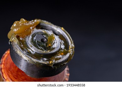 The ball bearing is greased with grease. Assembly work in a mechanical workshop. Dark background. - Shutterstock ID 1933448558