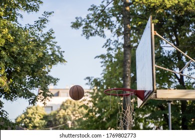 Ball Flying Into The Hoop During A Pickup Game Of Basketball In The Park