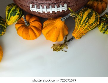 The Ball For Football With Pumpkins On The White Background. The Picture Is Awesome For Fall Football Game Invitation Card.