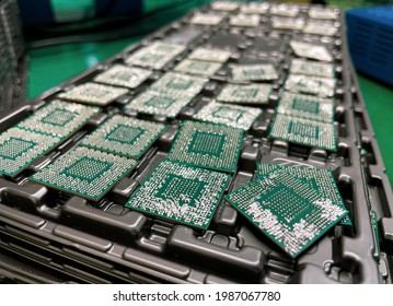 Ball Grid Array (BGA) chips or IC on ESD green pad .Consequences of unskilled repair, Electronic component fail ,blurred background and immage not focus 