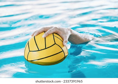 Ball, hand and water polo, swimming pool and sports with fitness, athlete and training for game. Person, swimmer and equipment with exercise, closeup and aquatic workout with challenge and match