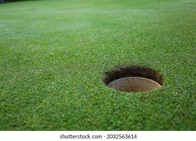 Ball hole on the green golf course. High quality photo - Shutterstock ID 2032563614