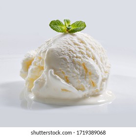 Ball of ice ream with mint on white background