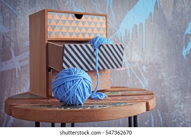 Ball of knitting yarn on wooden table