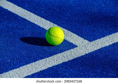 Ball next to the lines on a paddle tennis court. Racket sport concept. - Powered by Shutterstock