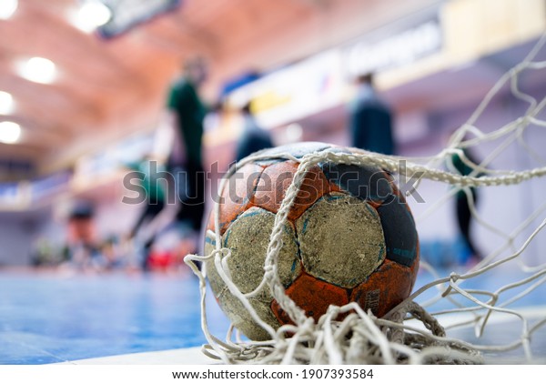 Ball on the\
floor at the goal, handball,\
futsal