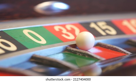 Ball on french roulette table in casino. Wheel spinning, turning or rotating. Odd and even numbers, black, red and zero sectors. Game of chance, money playing, gambling. Seamless looped cinemagraph.