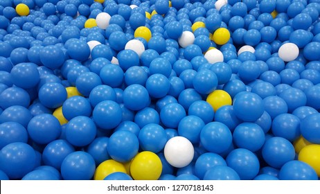 Ball pit in kid playground. There are blue, yellow and white plastic balls in ball pit for children to play.