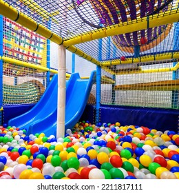 Ball Pit In Playground For Sport And Play Indoor, Inside Plastic Dry Pool With Slide. Children's Colorful Soft Playground, Gym For Kids Development In Playroom Close-up.