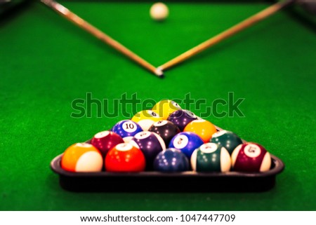 Ball placed on billiards table in a recreation hall for playing