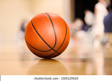 Ball Placed On Gym Floor During Basketball Timeout