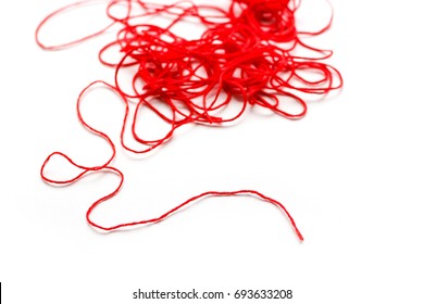 A Ball Of Red Wool Yarn. Closeup. Isolated On White Background.