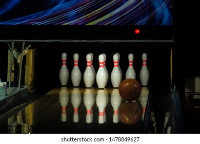 Ball Rolling On The Right Side A Bowling Alley Lane With Pins