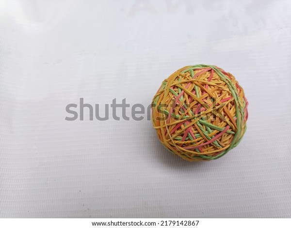 Ball\
from rubber band crafts. round shape. and\
colorful
