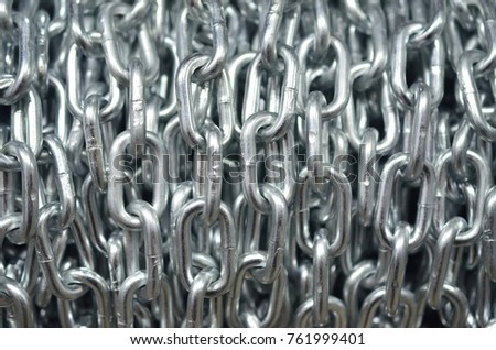 A ball of shiny metal chain of large links
