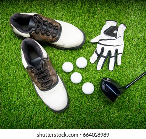 ball, shoe, glove, tee and golf-club driver, golf gear and equipment on flat lay top view.