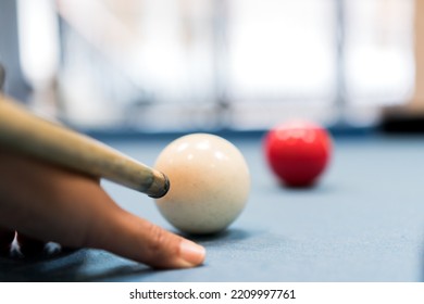 Ball Snooker or billiards Player playing in table sport, snooker game player aiming cue white ball in bar - Shutterstock ID 2209997761