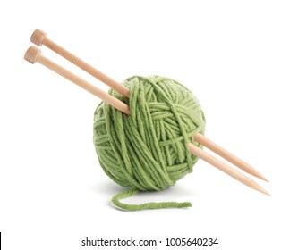 Ball Of Thread And Knitting Needles On White Background