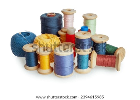 ball of thread, spool of sewing thread and needle isolated on white background, close-up
