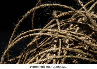 A Ball Of Twine Rope On A Black Background