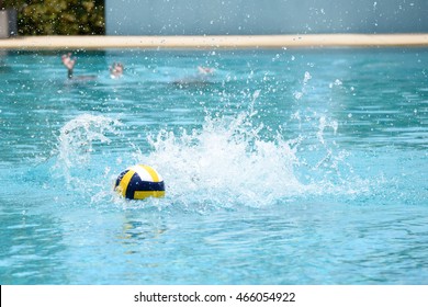 Ball In Water Splash At Swimming Pool