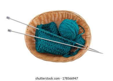 Ball Of Wool And Knitting In The Basket For Needlework On A White Background, Top View