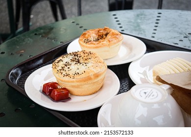 Ballarat, Vic Australia - April 20 2022: Outdoor Cafe Dining At Bakery With Meal Of Meat Pies And Sauce And Coffee And Cake