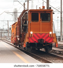 Ballast distributing and profiling track machine. Repair train