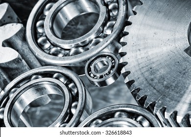 ball-bearings and cogwheels in a machinery concept