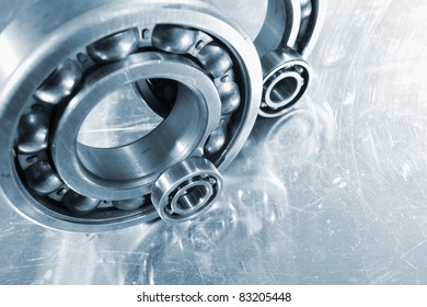 ball-bearings mirrored in titanium, blue toning idea, focal-point on small gear.