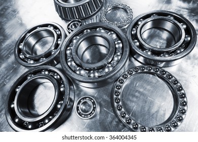 Ball-bearings, Pinions Against Brushed Aluminum, Titanium And Steel Aerospace Parts