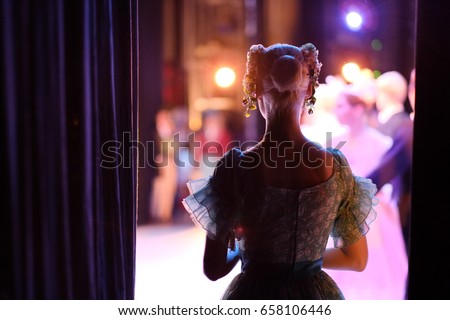 A ballerina awaiting the moment of entering the stage in the play