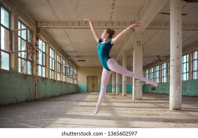 Ballerina Dancing In An Old Building. Young, Elegant, Graceful Woman Ballet Dancer