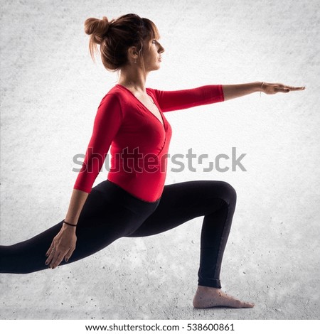 Ballerina dancing on textured background