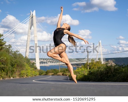 
Ballerina girl dancing in Istanbul skyline.