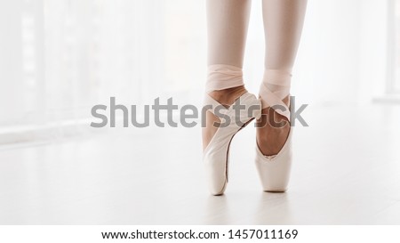 Ballerina Legs On Pointe Shoes Closeup On White Background. Classic And Modern Ballet Concept With Copy Space. Crop, Panorama