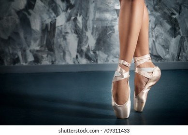 Ballerina in pointe shoes. Ballet posing, performance