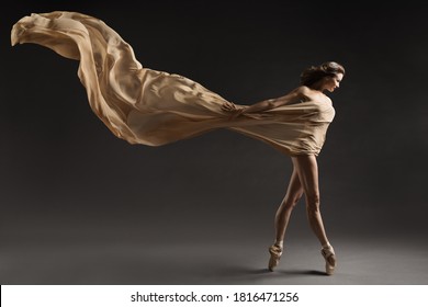Ballerina Walking with Silk Fabric, Modern Ballet Dancer in Pointe Shoes, Fluttering Waving Cloth, Gray Background