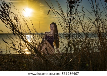 Similar – Young woman on the beach in the sun